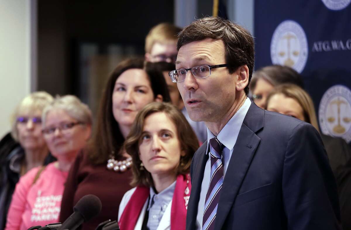 FILE - In this Feb. 25, 2019, file photo, Washington state Attorney General Bob Ferguson speaks at a news conference announcing a lawsuit challenging the Trump administration's Title X "gag rule" in Seattle. A U.S. appeals court says new Trump administration rules imposing additional hurdles for women seeking abortions can take effect. Courts in Washington, Oregon and California had blocked the rules from taking effect. The rules ban taxpayer-funded clinics from making abortion referrals and prohibit clinics that receive federal money from sharing office space with abortion providers. The 9th U.S. Circuit Court of Appeals on Thursday said the lower courts appeared to have gotten the rulings wrong. (AP Photo/Elaine Thompson, File)