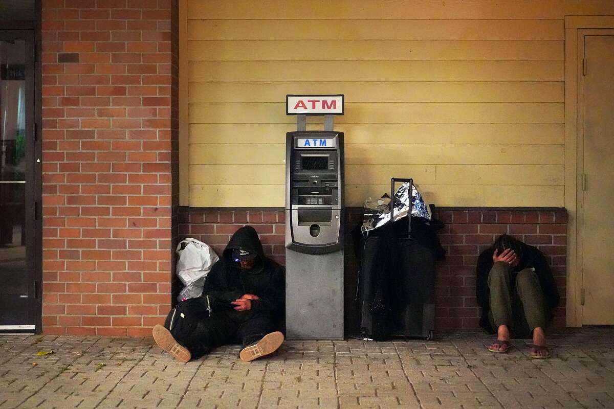 FILE - In a tweet that has since gone viral, a local journalist accused a Castro Japanese restaurant for posturing as inclusive while using anti-homeless architecture. Homeless men at the Pittsburg BART on Thursday, June 6, 2019, in Pittsburg, Calif.