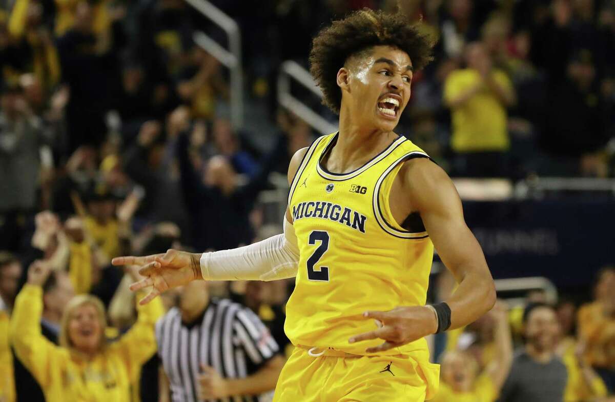 Jordan Poole #2 of the Michigan Wolverines reacts after a second half three point basket while playing the Ohio State Buckeyes at Crisler Arena on January 29, 2019 in Ann Arbor, Michigan. Michigan won the game 65-49.