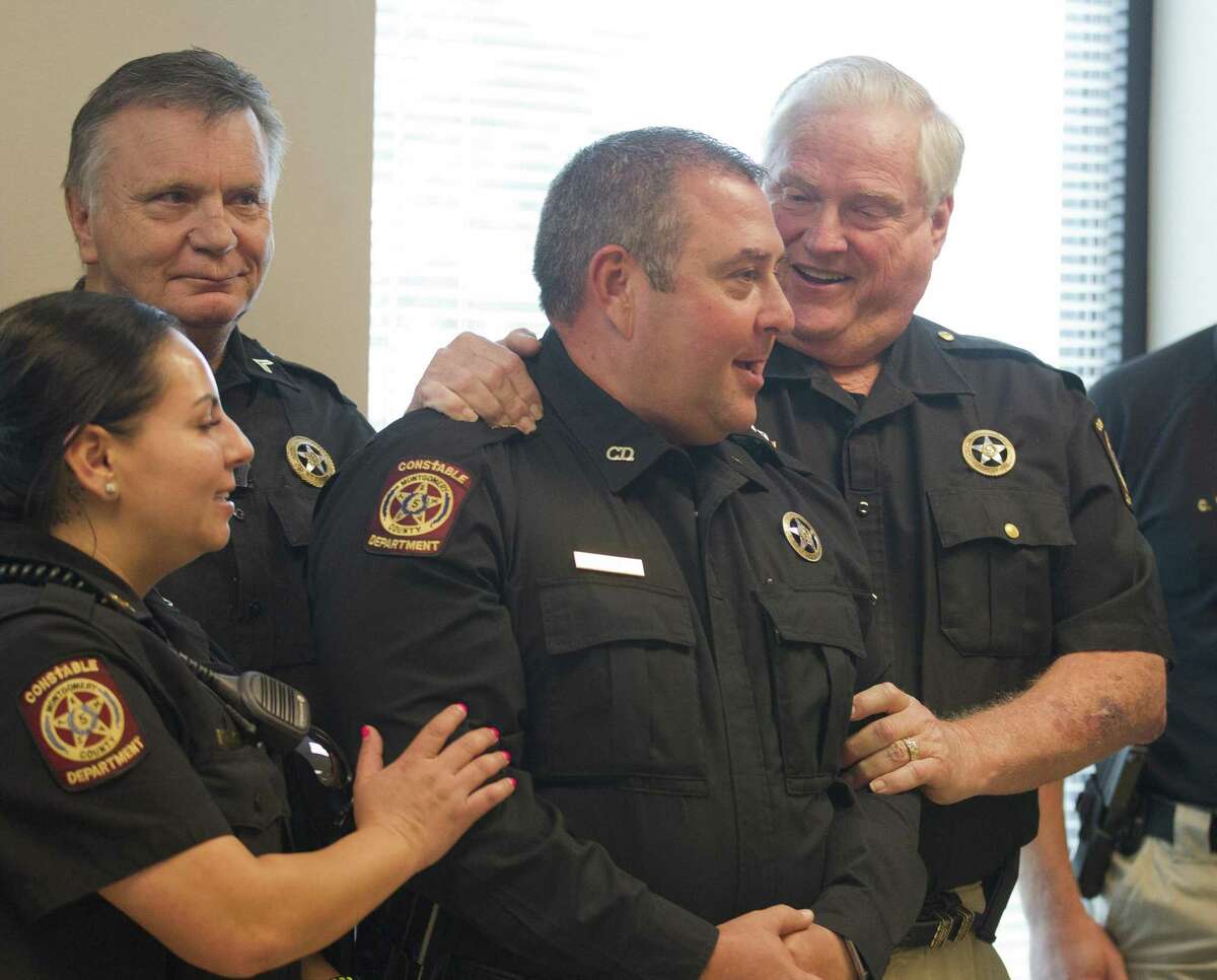 Montgomery County Precinct 5 Constable Chris Jones was appointed to fill the unexpired term of former Constable David Hill 9 (left) during a Montgomery County Commissioners Court meeting in September.