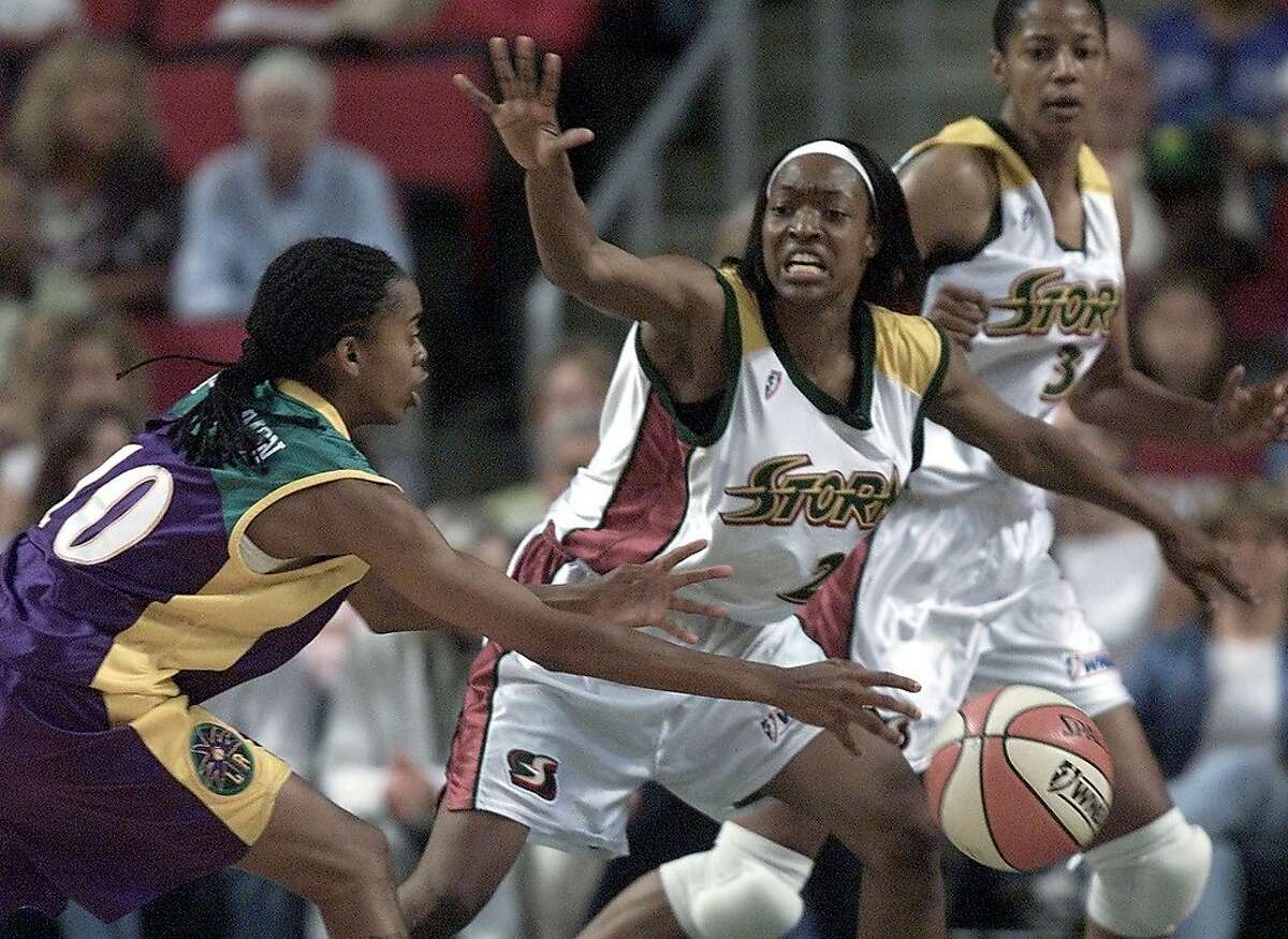 Seattle-08/09/00-Seattle Storm 's #21 Charmin Smith tries to block pass by Los Angeles Sparks #10 Nicky McCrimmon in the 1st half.. Photo by Paul Kitagaki Jr./Seattle Post-Intelligencer (For Sports section - no reporter assigned)