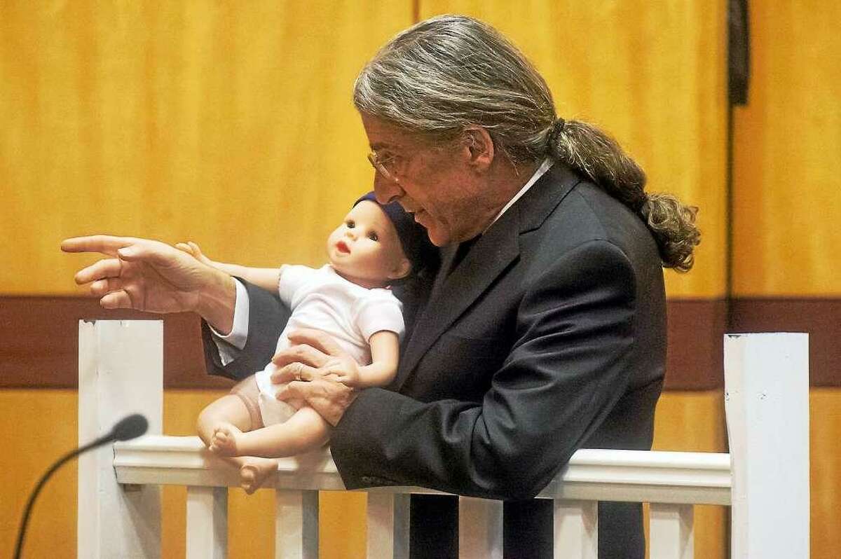 During his final arguments in the 2015 murder trial of Tony Moreno, defense attorney Norm Pattis demonstrates how his client could not have been sending a text message at the time a passing motorist testified seeing him holding his son on the Arrigoni Bridge in Middletown.