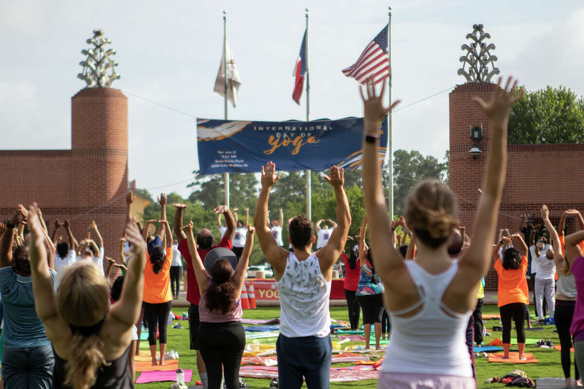 If you're starting to waver on your New Year's resolution, you might need to set a more specific goal and create an action plan, Houston psychologists said. In this 2019 file photo, stretch during an International Yoga Day event at Town Green Park in The Woodlands.