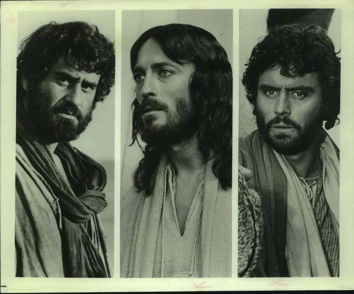 "Jesus of Nazareth," the award-winning story of the life of Christ, stars Robert Powell (center) as Jesus. James Farentino portrays Simon Peter (left) and Ian McShane is Judas in the Biblical epic directed by Franco Zeffirelli and sponsored by the products of the Procter & Gamble Company. The eight-hour television special included footage never before seen in this country.