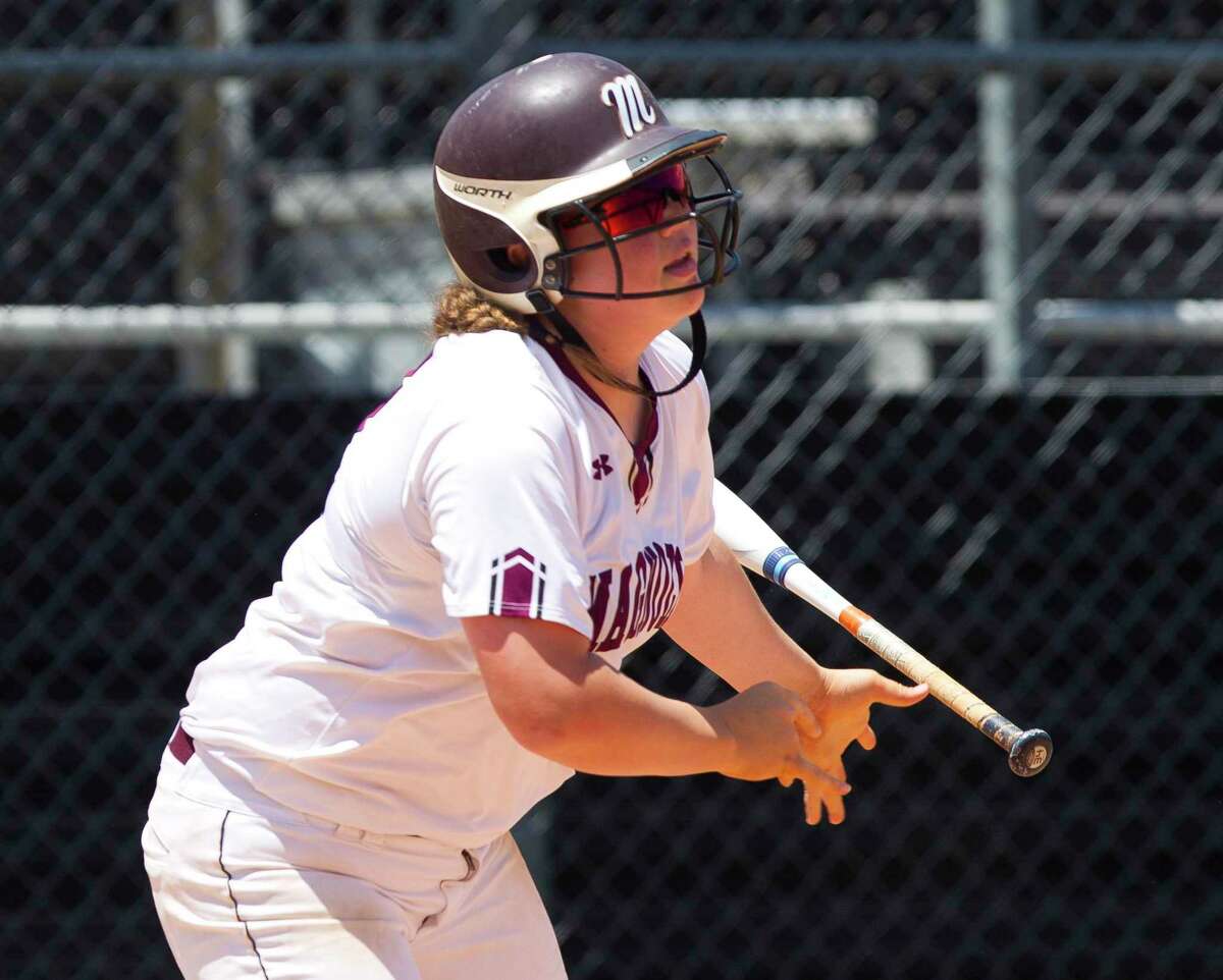 Magnolia first baseman Jamison Holder (21) watches her hit land for a two-run double during the third inning in Game 3 of a Region III-5A bi-district softball playoff match, Saturday, April 27, 2019, in Conroe.