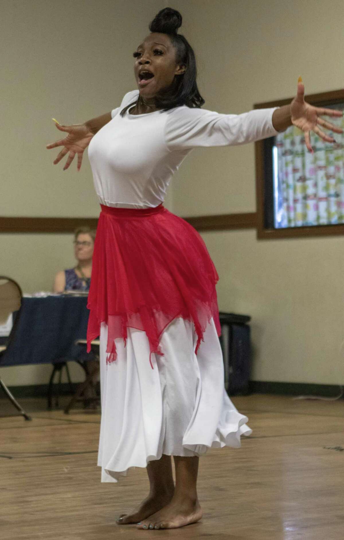 Dancer Denisha Felder performs a gospel dance Saturday during a Juneteenth celebration at the Oscar Johnson, Jr. Community Center. June 19 marked the 154th anniversary of the end of slavery for African Americans in Texas.