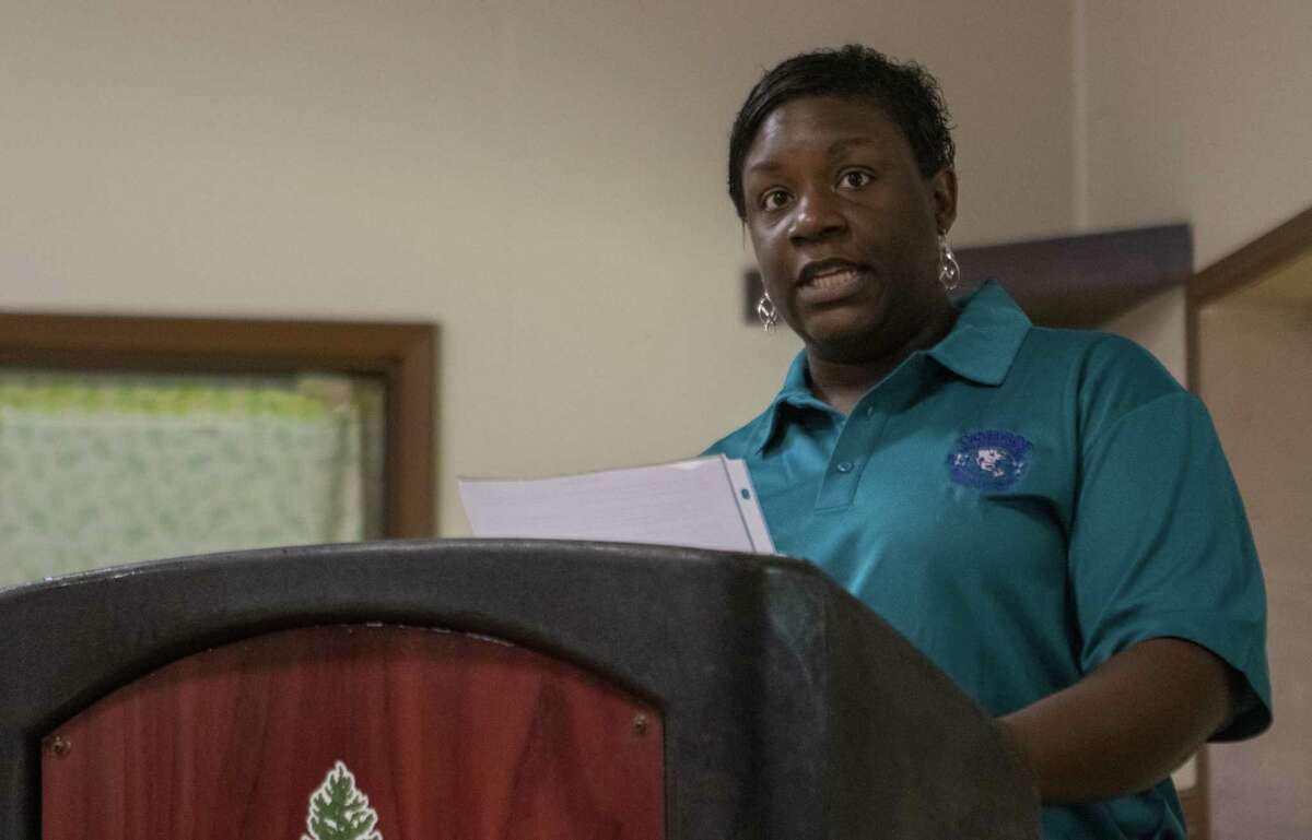 Lucresha Sheffield with Conroe Concerned Citizens reads a history of the group Saturday during a Juneteenth celebration at the Oscar Johnson, Jr. Community Center. June 19 marked the 154th anniversary of the end of slavery for African Americans in Texas.