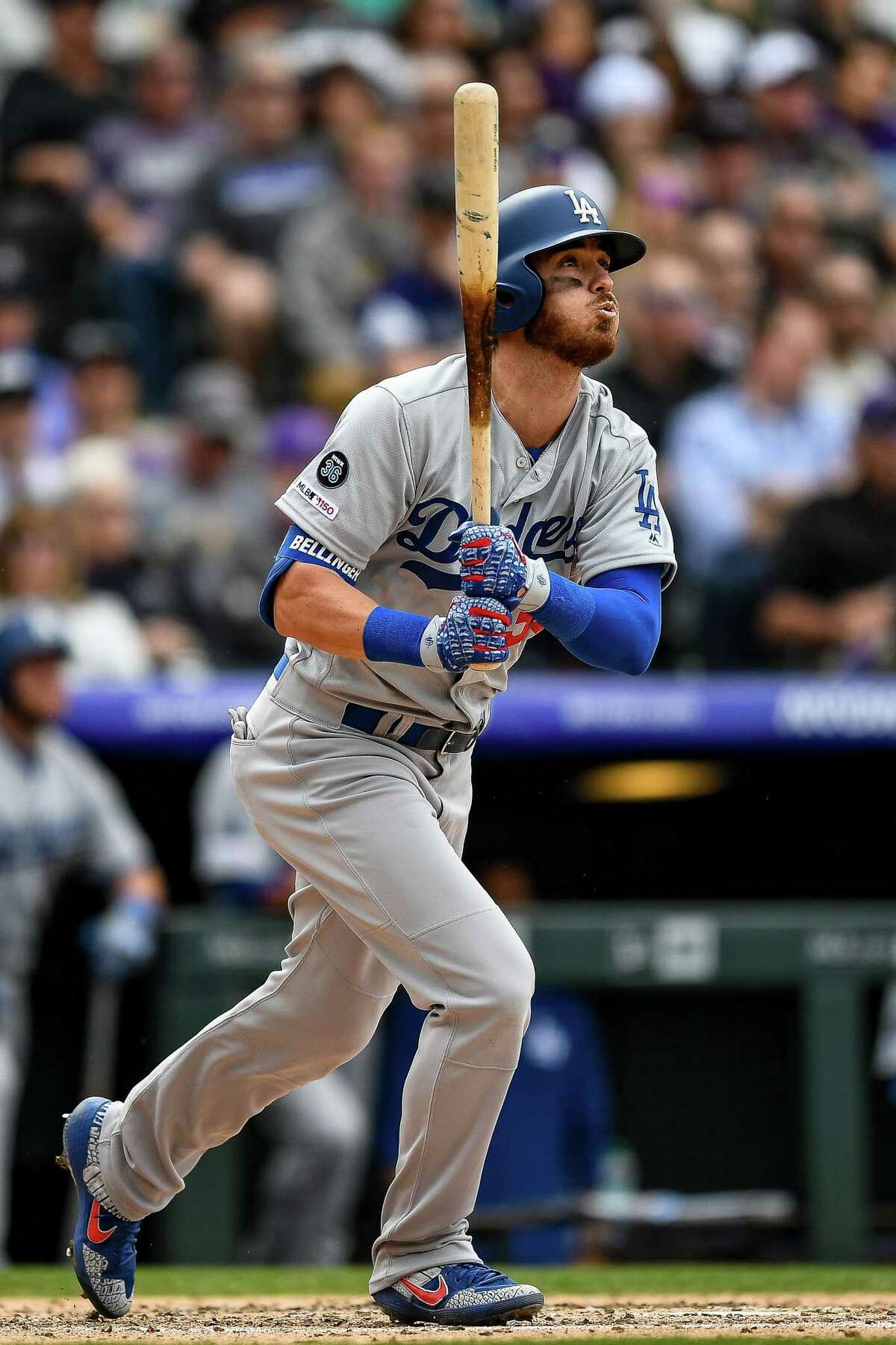DENVER, CO - APRIL 5: Cody Bellinger #35 of the Los Angeles Dodgers watches the flight of a fifth inning three-run homer against the Colorado Rockies during the Colorado Rockies home opener at Coors Field on April 5, 2019 in Denver, Colorado. (Photo by Dustin Bradford/Getty Images)