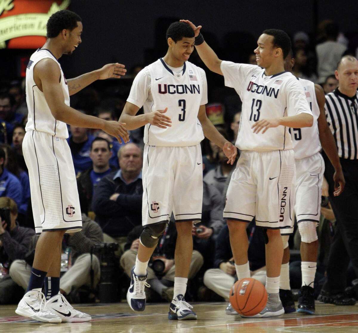 Connecticut's Jeremy Lamb (3) celebrates a basket with teammates Shabazz Napier (13) and Jamal Coombs-McDaniel during the first half of an NCAA college basketball game against DePaul at the Big East Championship, Tuesday, March 8, 2011 at Madison Square Garden in New York. (AP Photo/Mary Altaffer)