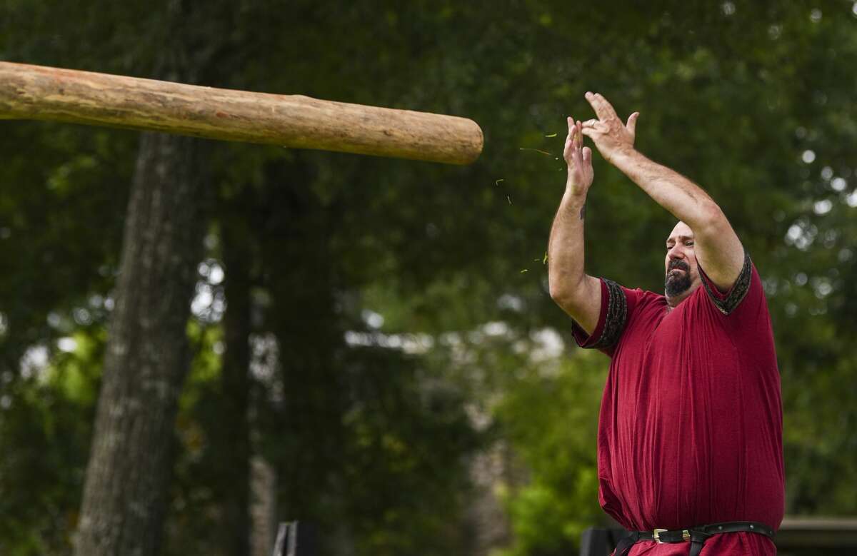 Jonathan Lockwood of Lexington, who goes by Edric Haldyn, throws a log during the caber toss event the Bordermarch Baronial Highland Games at St. Stephen's Episcopal Church Saturday afternoon. The event was put on by the Society for Creative Anachronism. The group, which is also known as SCA, research and recreate ways of life before the 17th century. Beaumont is located in the Ansteorra, Swedish for Lone Star, kingdom which includes Texas and Oklahoma. SCA members participate in many different events including making their own armor, chivalric fighting, archery and textile production. While many members choose to follow medieval Europe ideas some choose instead vikings or samurais. Photo taken on Saturday, 06/22/19. Ryan Welch/The Enterprise