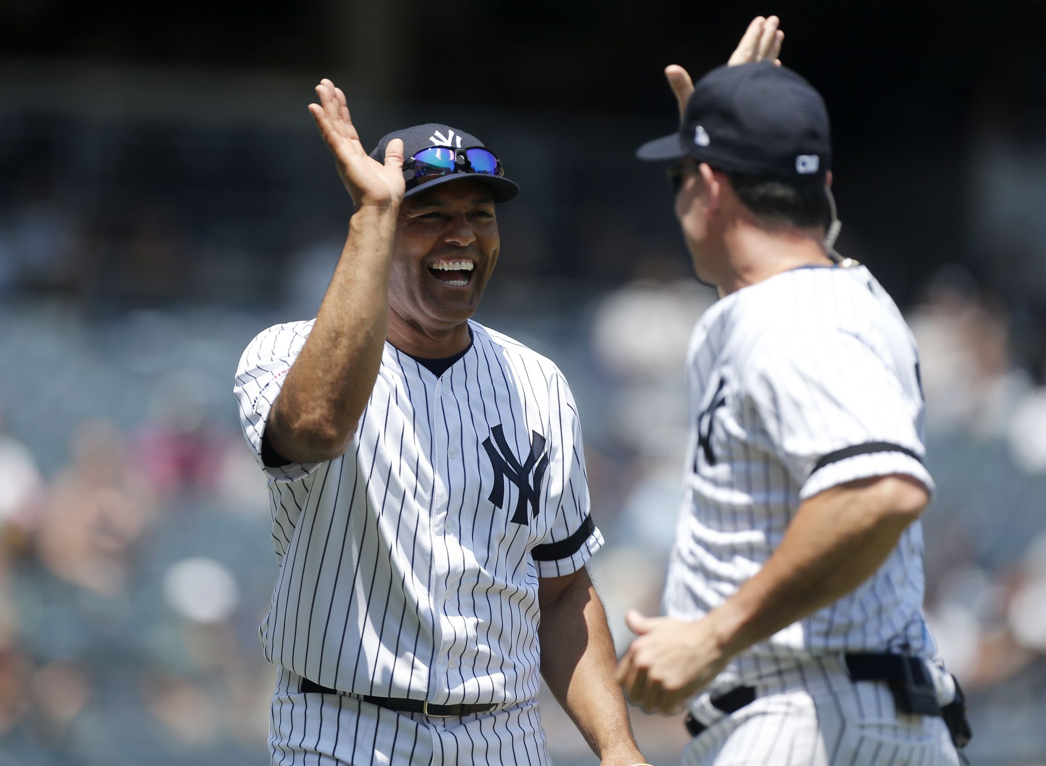 Former New York Yankees players, including Mariano Rivera, center, pose for  a picture during Old Timer's Day at Yankee Stadium, Sunday, June 23, 2019,  in New York. (AP Photo/Seth Wenig Stock Photo 