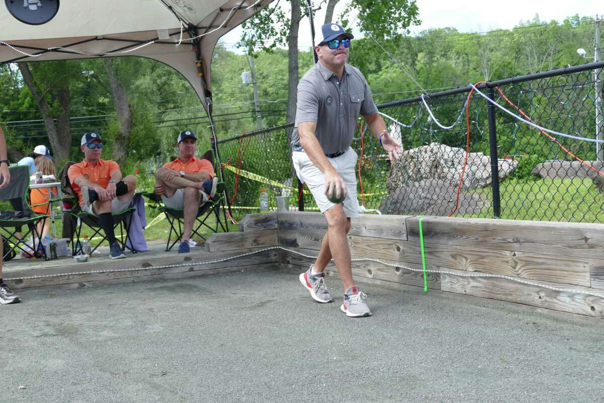 Mike Rosella tosses a bocce ball Friday, June 21. Rosella is a member of Ridgefield 8, who competed and broke the Guinness World Record title for the longest marathon playing bocce team last weekend.