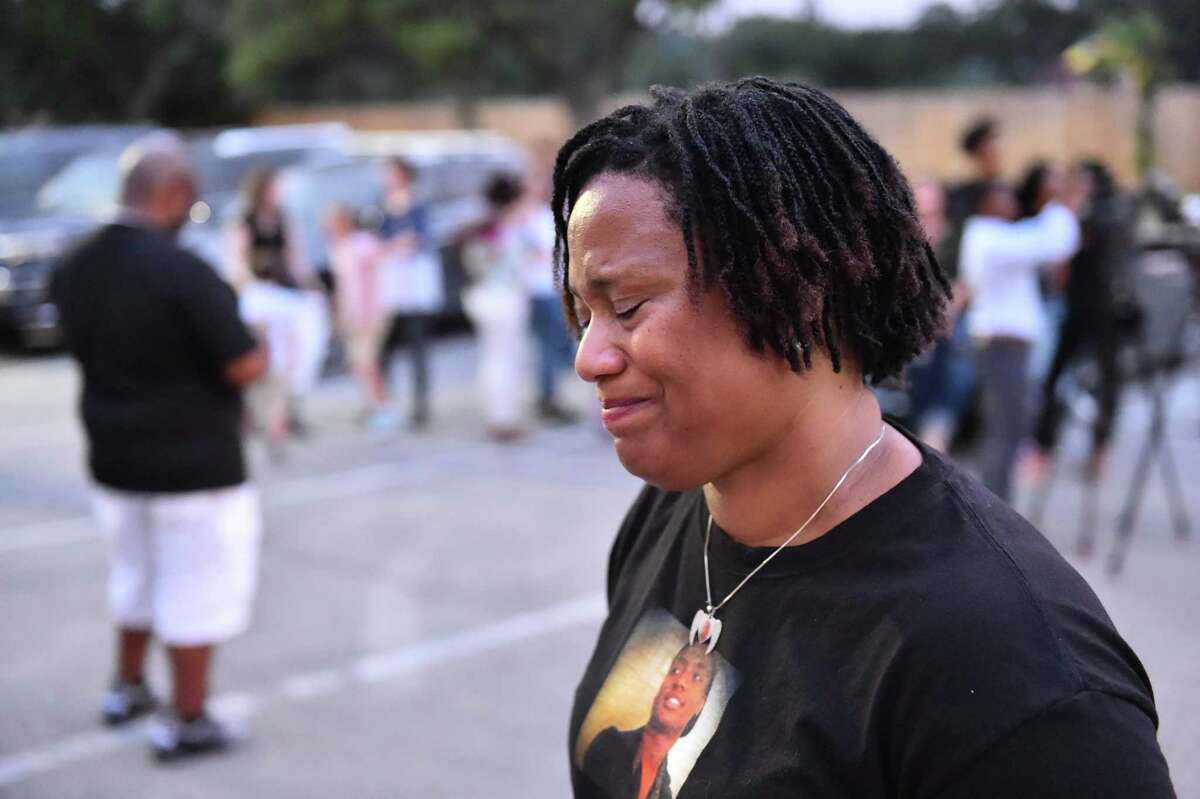 Jeanelle Cornelius smiles while recalling her son, 25 year old Brandon Cornelius who was murdered one year ago, during a candlelight vigil Sunday evening.His assailants haven’t been found. The vigil took place at the site of Cornelius’ murder, The Ridge Shopping Center. Photo by Robin Jerstad:correspondent