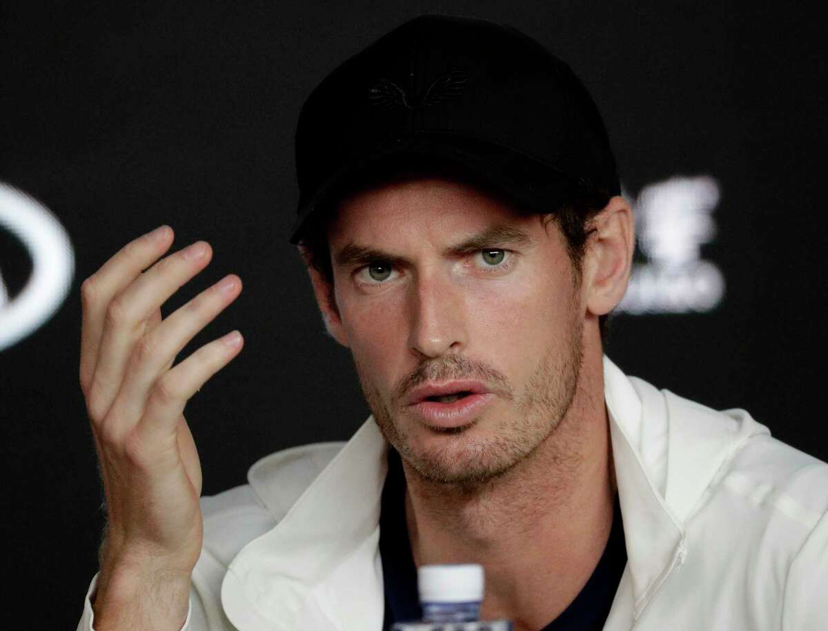 FILE - In this Tuesday, Jan. 15, 2019 file photo, Britain's Andy Murray answers questions at a press conference following his first round loss to Spain's Roberto Bautista Agut at the Australian Open tennis championships in Melbourne, Australia. Three-time major champion Andy Murray posted a message Tuesday Jan. 29, 2019 on Instagram saying he had hip resurfacing surgery and had a metal joint implanted on Monday in London. (AP Photo/Aaron Favila, File)