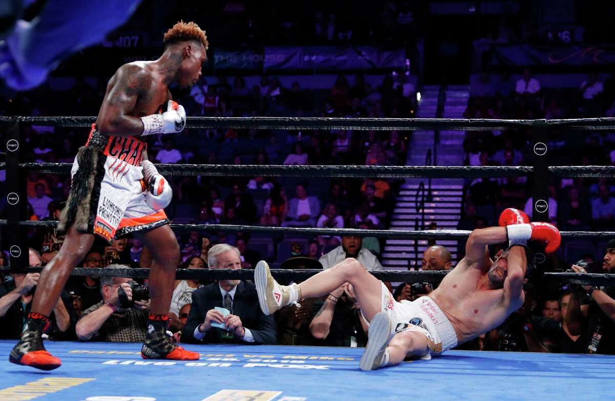 Jermell Charlo knocks down Jorge Cota, of Mexico, in a junior middleweight boxing match Sunday, June 23, 2019, in Las Vegas. (AP Photo/John Locher)