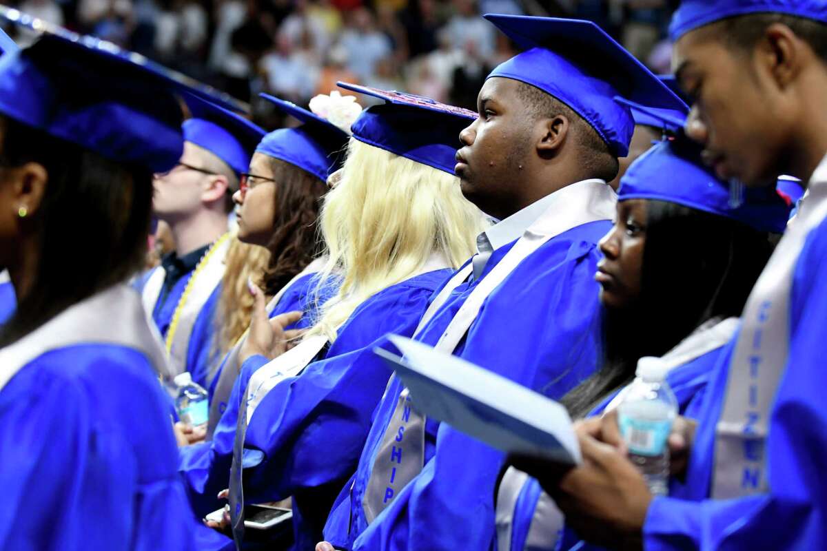 Albany High School seniors stand to graduate during the 149th commencement exercises on Sunday, June 23, 2019, at the Times Union Center in Albany, N.Y. (Catherine Rafferty/Times Union)