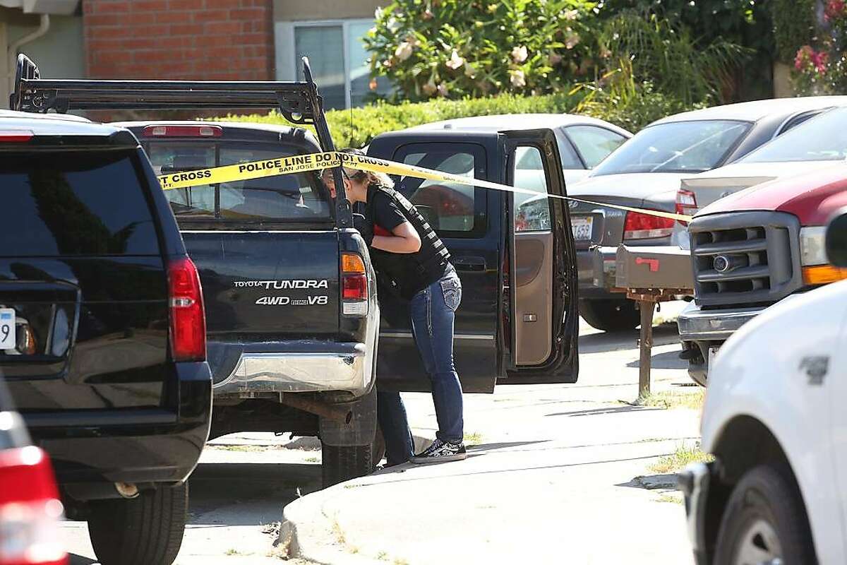 Emergency responders investigate at a truck on Habbitts Court as they work at the scene of a multiple shooting on Monday, June 24, 2019 in San Jose, Calif. At least five people - including the suspect - have died following what San Jose police are calling a quadruple murder-suicide, which included a standoff that started Sunday night and ended early Monday morning.