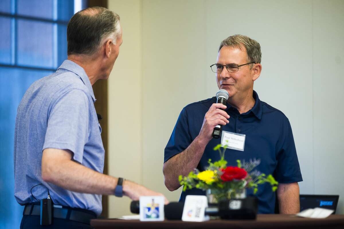 FILE — Dow CEO Jim Fitterling, left, chats with Currie Golf Course General Manager Paul Milholland, right, during a Media Day event for the upcoming Great Lakes Bay Invitational on Monday, June 24, 2019 at the Midland Country Club. (Katy Kildee/kkildee@mdn.net)