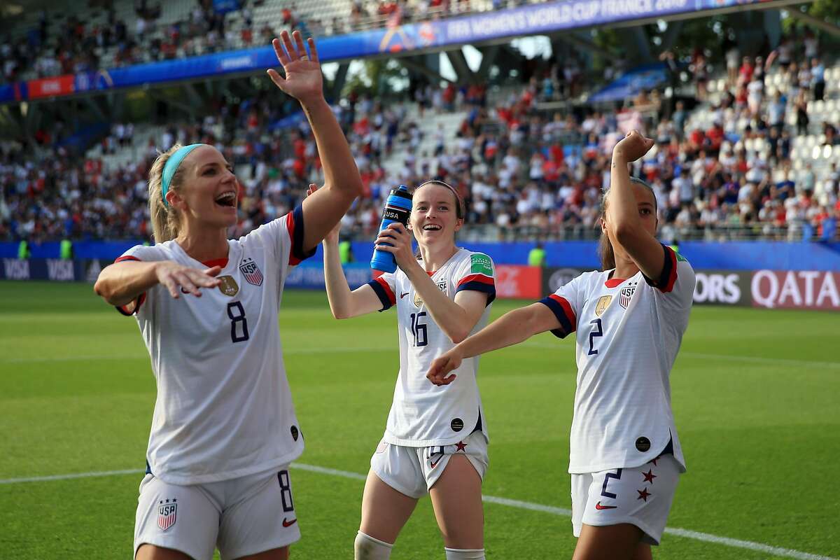 REIMS, FRANCE - JUNE 24: (L-R) Julie Ertz, Rose Lavelle and Mallory Pugh of the USA celebrate victory after the 2019 FIFA Women's World Cup France Round Of 16 match between Spain and USA at Stade Auguste Delaune on June 24, 2019 in Reims, France. (Photo by Marc Atkins/Getty Images)