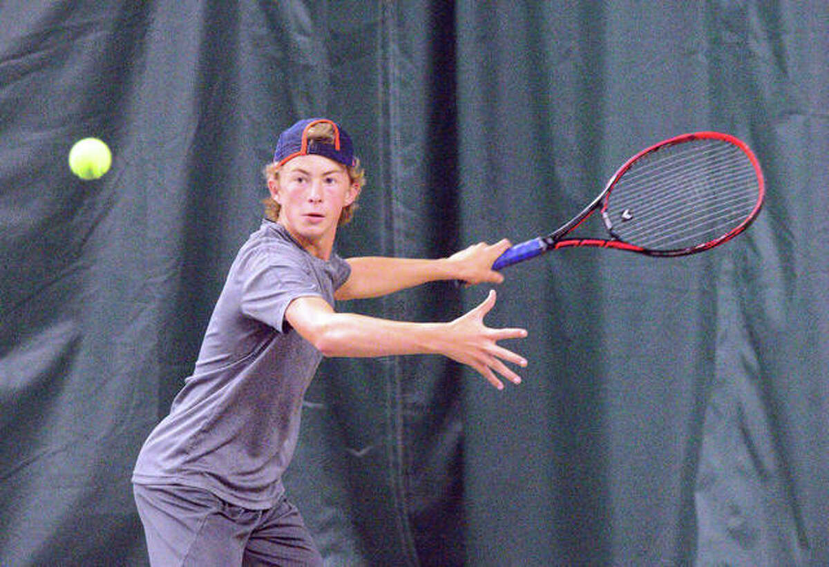 Colton Hulme makes a forehand return during his match against Michael Karibian on Sunday in the boys’ 14 singles final of the Tiger Classic at the Edwardsville Meyer Center YMCA.