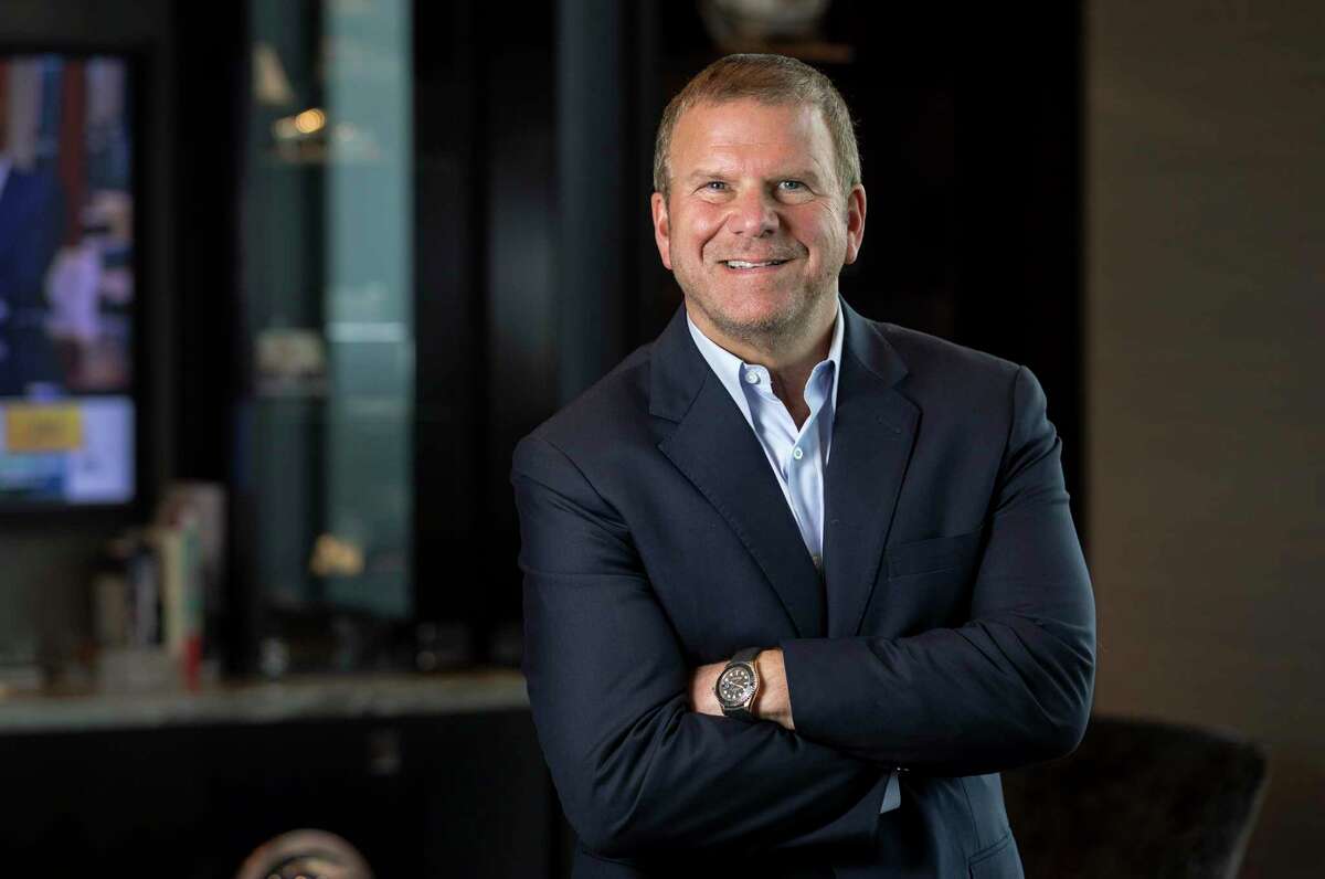 Tilman Fertitta, owner of Landry's, Inc., and the Houston Rockets, poses for a portrait in his office. Fertitta's Post Oak Hotel first circulated, then rescinded, a memo notifying employees that their benefits would be cut as restaurants have had to shut down.