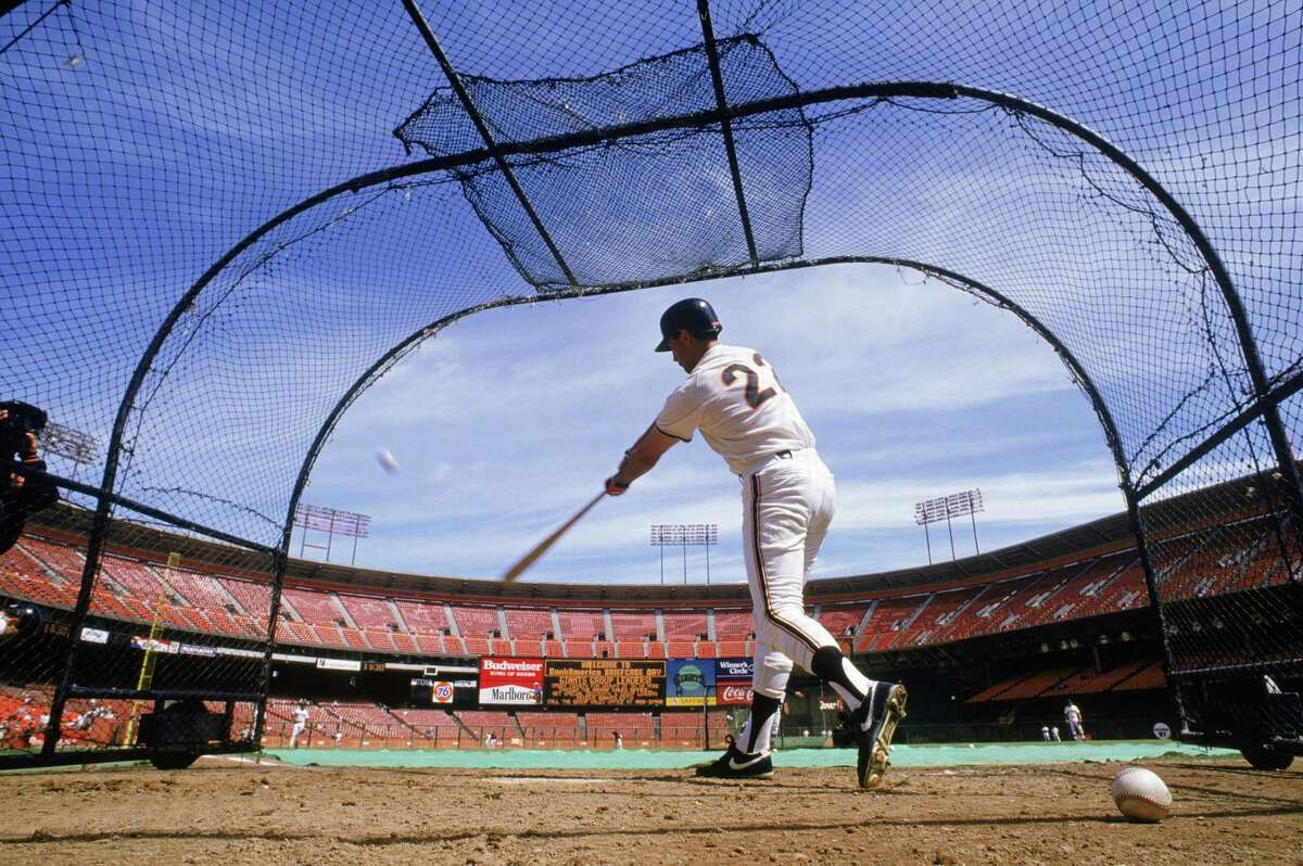 Will Clark of the San Francisco Giants hits during batting practice before a game in the 1989 season at Candlestick Park.