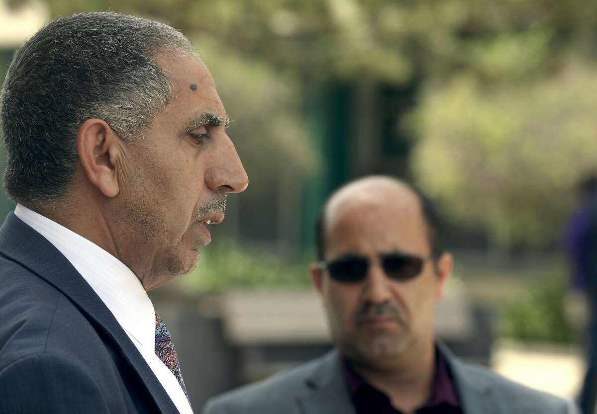 Yemeni consul general Mansoor Ismael (left) speaks at a press conference on behalf of victim's families on Monday, June 24, 2019, in San Mateo, Calif. He speaks after the arraignment of suspect Malik Dosouqi, 26, alleged to have possibly lured two men under false pretenses to a remote section of Hwy. 35 where he stabbed them to death.