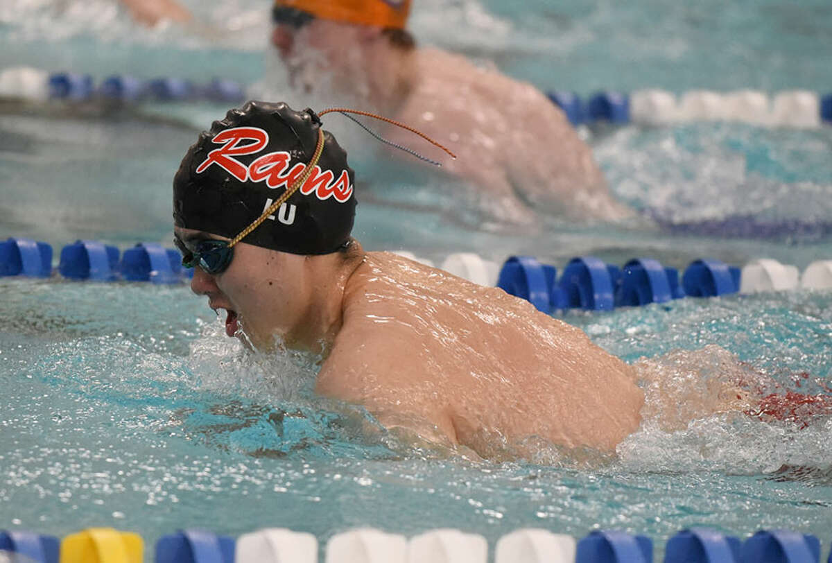 New Canaan senior co-captain Daniel Lu competes in the 100 breaststroke during the Rams' Senior Day win over Danbury at the New Canaan YMCA on Wednesday, Feb. 6. — Dave Stewart/Hearst Connecticut Media