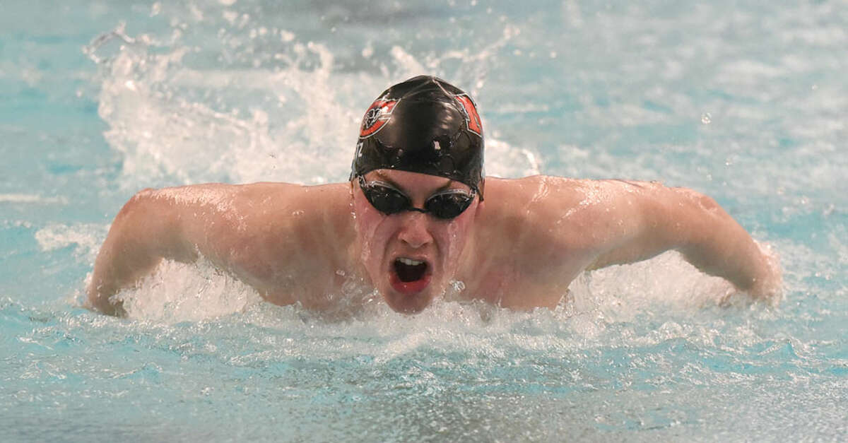 New Canaan senior co-captain Jake Ritz competes in the 100 butterfly during the Rams' Senior Day win over at the Danbury New Canaan YMCA on Wednesday, Feb. 6. — Dave Stewart/Hearst Connecticut Media
