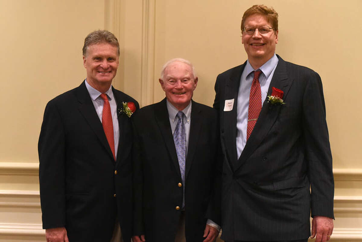 New Canaan High School athletic director Jay Egan, former Rams' basketball coach Don Usher, and Monroe Trout, who was inducted into the NCHS Sports Hall of Fame last Friday at the Woodway Country Club. — Dave Stewart photo