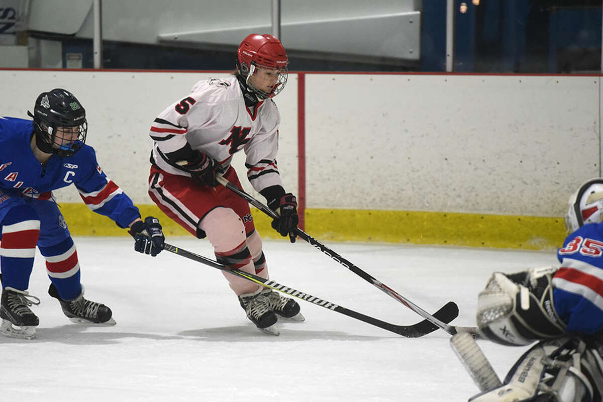 New Canaan's Anika Curri (5) gets a shot on net during the first period of the Rams' 7-0 win over Fairfield Tuesday night at the Darien Ice Rink. — Dave Stewart photo