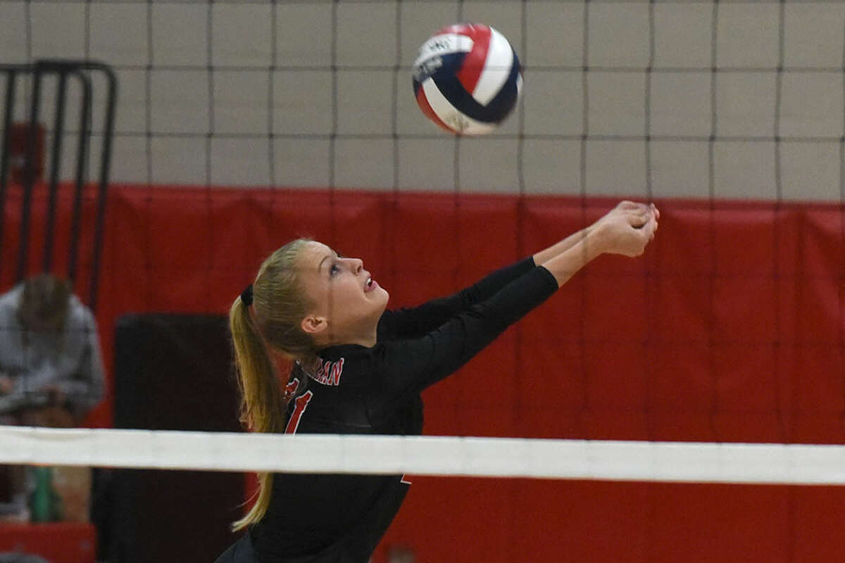 New Canaan senior co-captain Emma Wheeler keeps the ball alive during a recent match at NCHS. — Dave Stewart photo