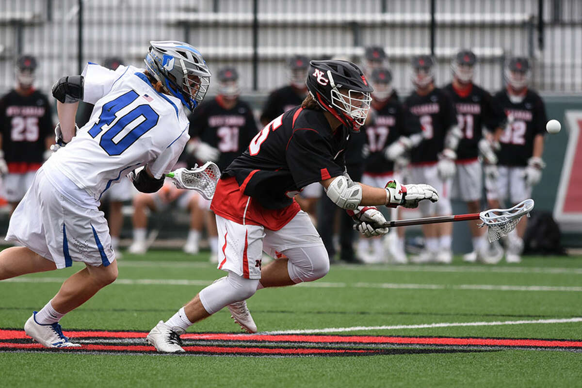 New Canaan's Nick Crovatto wins a faceoff during the CIAC Class L semifinals Wednesday in Fairfield. — Dave Stewart photo
