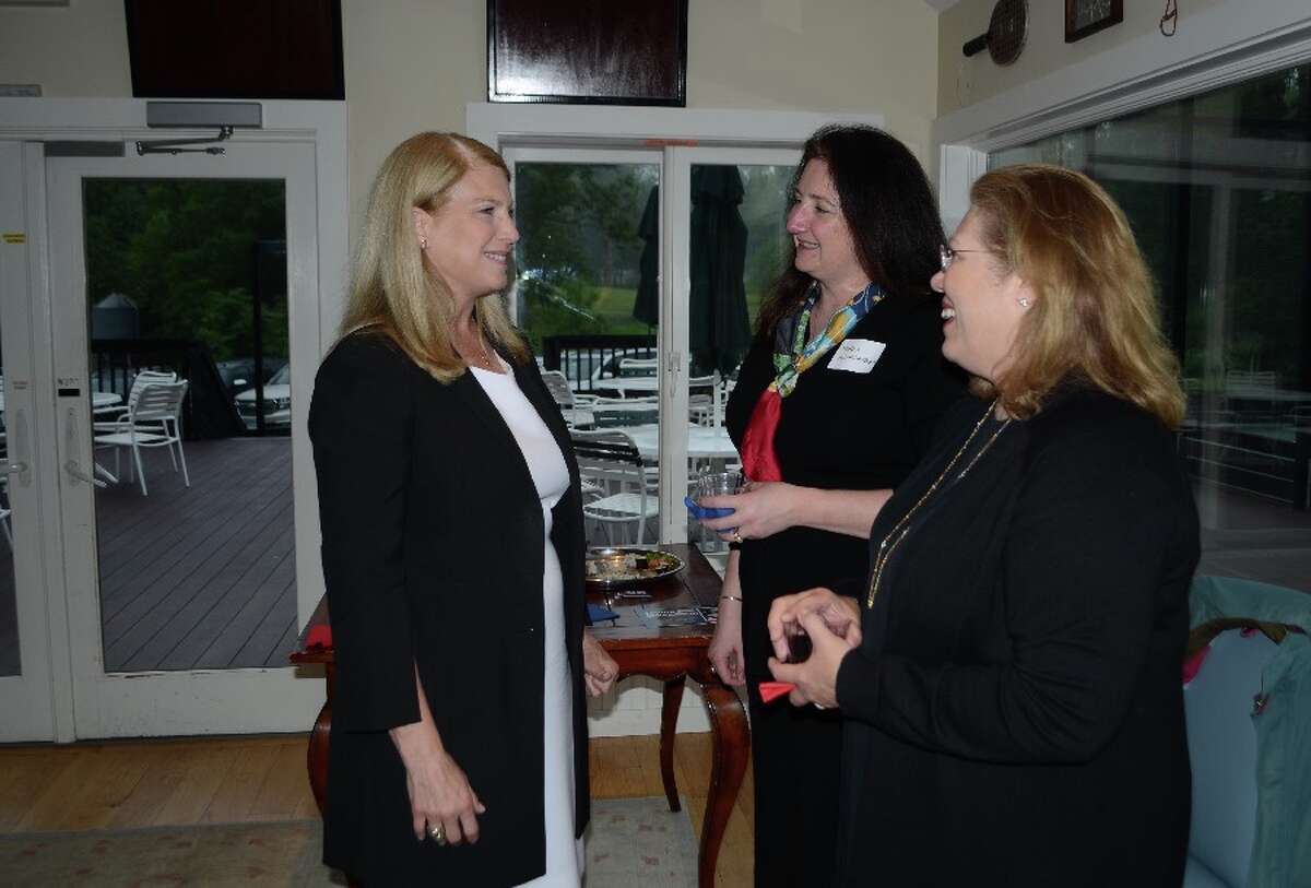 Jayme Stevenson, Darien First Selectman and candidate for lieutenant governor, at left, in the Country Club of New Canaan's paddle tennis hut on May 31 for a meet-and-greet. With her were New Canaan RTC member Maria Weingarten, center, and New Canaan Town Council member Cristina Ross. — Greg Reilly photo