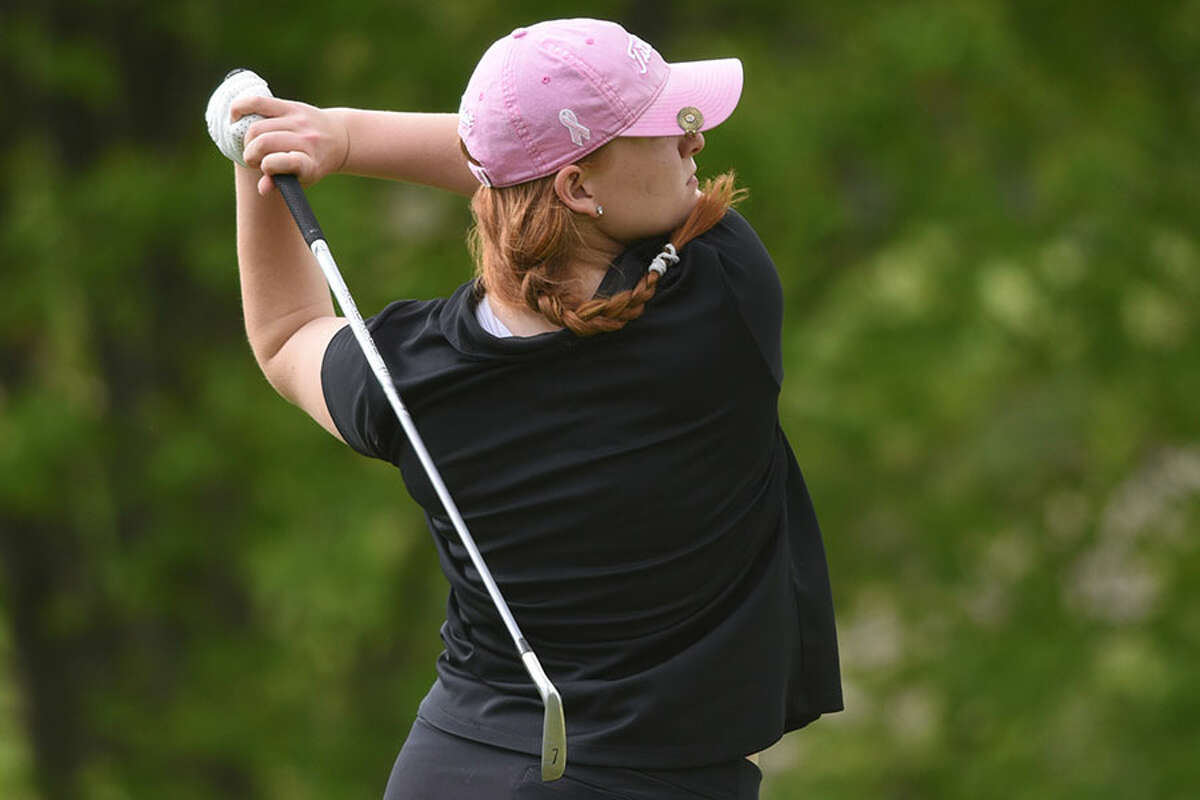 New Canaan's Meghan Mitchell follows through on a drive during a recent match at the Country Club of New Canaan. — Dave Stewart/Hearst Connecticut Media
