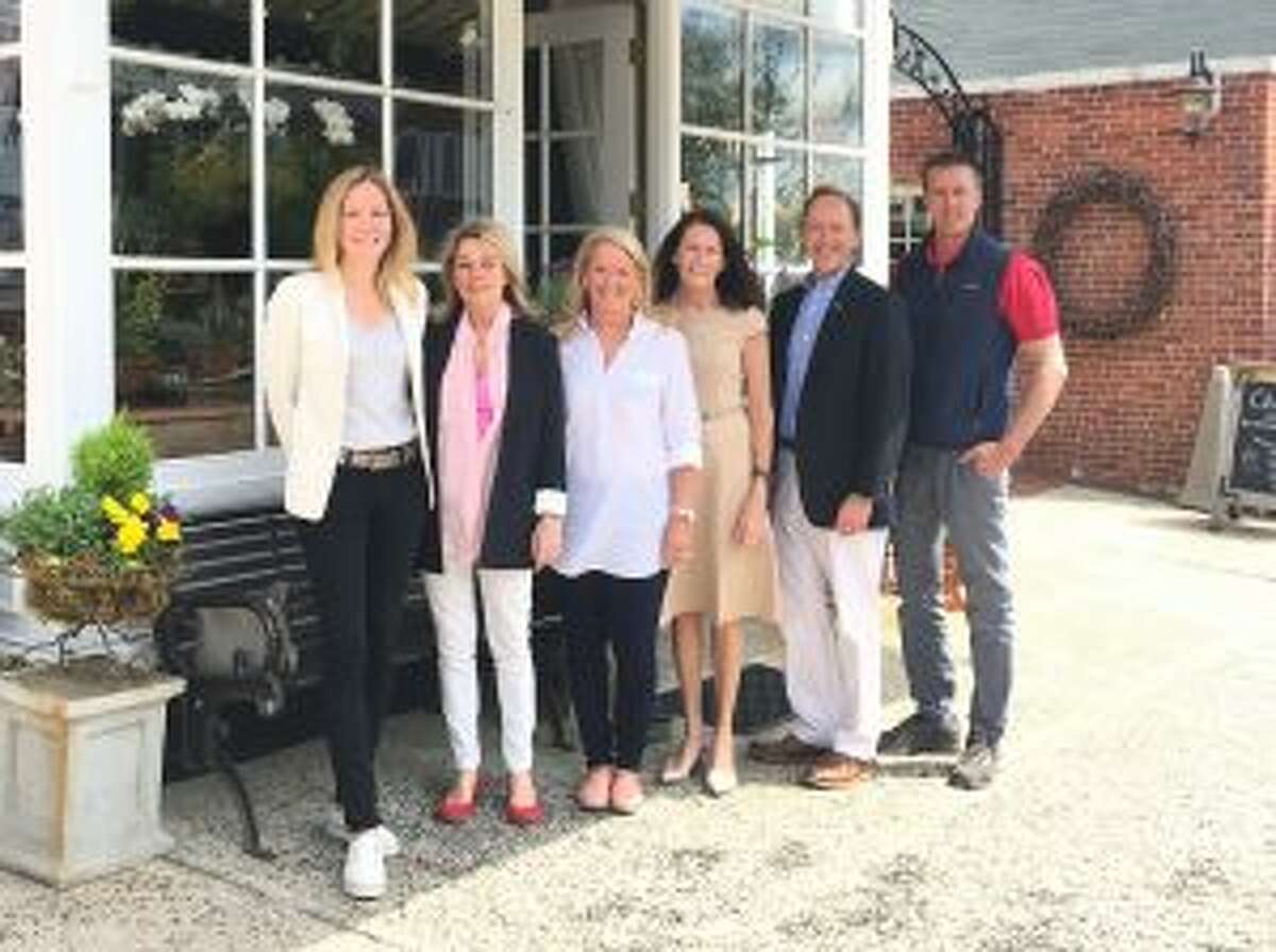 2018 Art In The Windows organizers and sponsors Hilary Wittmann of Carriage Barn Arts Center; Karen Solomon of Shoes n’ More; Tucker Murphy, Chamber of Commerce; Lori Kelly, New Canaan Board of Realtors; Steve Karl of Karl Chevrolet, and Rob Hutchinson of Hutchinson Tree Care. — Contributed photo