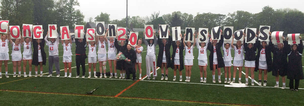 The New Canaan Rams congratulate head coach Kristin Woods on her 200th victory. — Dave Stewart photo