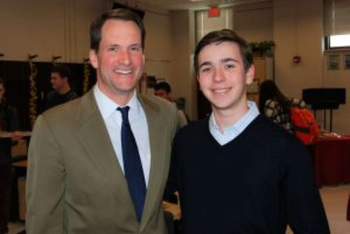 Congressman Jim Himes recently spoke at New Canaan High School. U.S. Rep. Jim Himes visits with New Canaan High School’s Current Events Cafe founder Griffin Fill on April 30 at the school. — Contributed photo