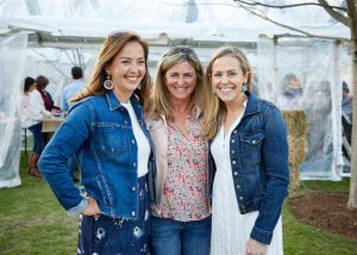 Hundreds dined "Under the Stars" on the campus of New Canaan Country School. The Country Night Under the Stars biennial dinner and auction organizers are shown, from left, Mariko LeBaron of New Canaan, Susan Barr of Darien and Sarah Irwin of New Canaan. — Contributed photo