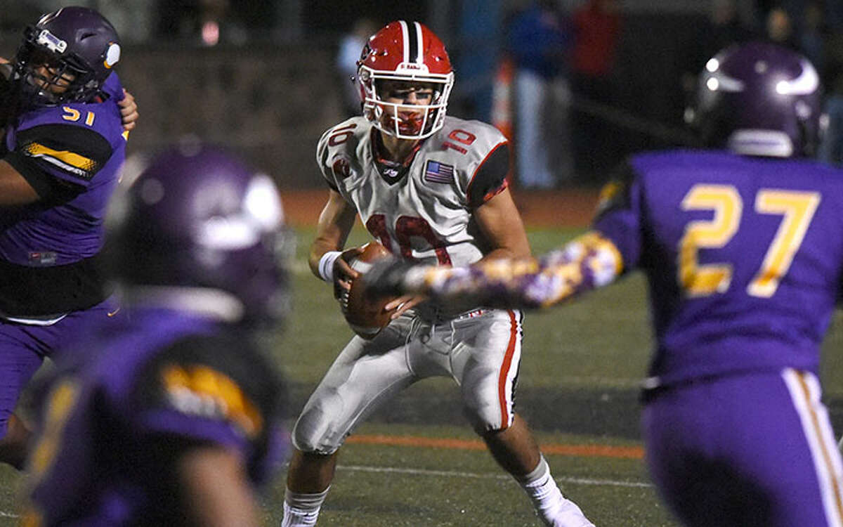 New Canaan quarterback Drew Pyne in action during the Rams' win over Westhill last fall. — Dave Stewart photo