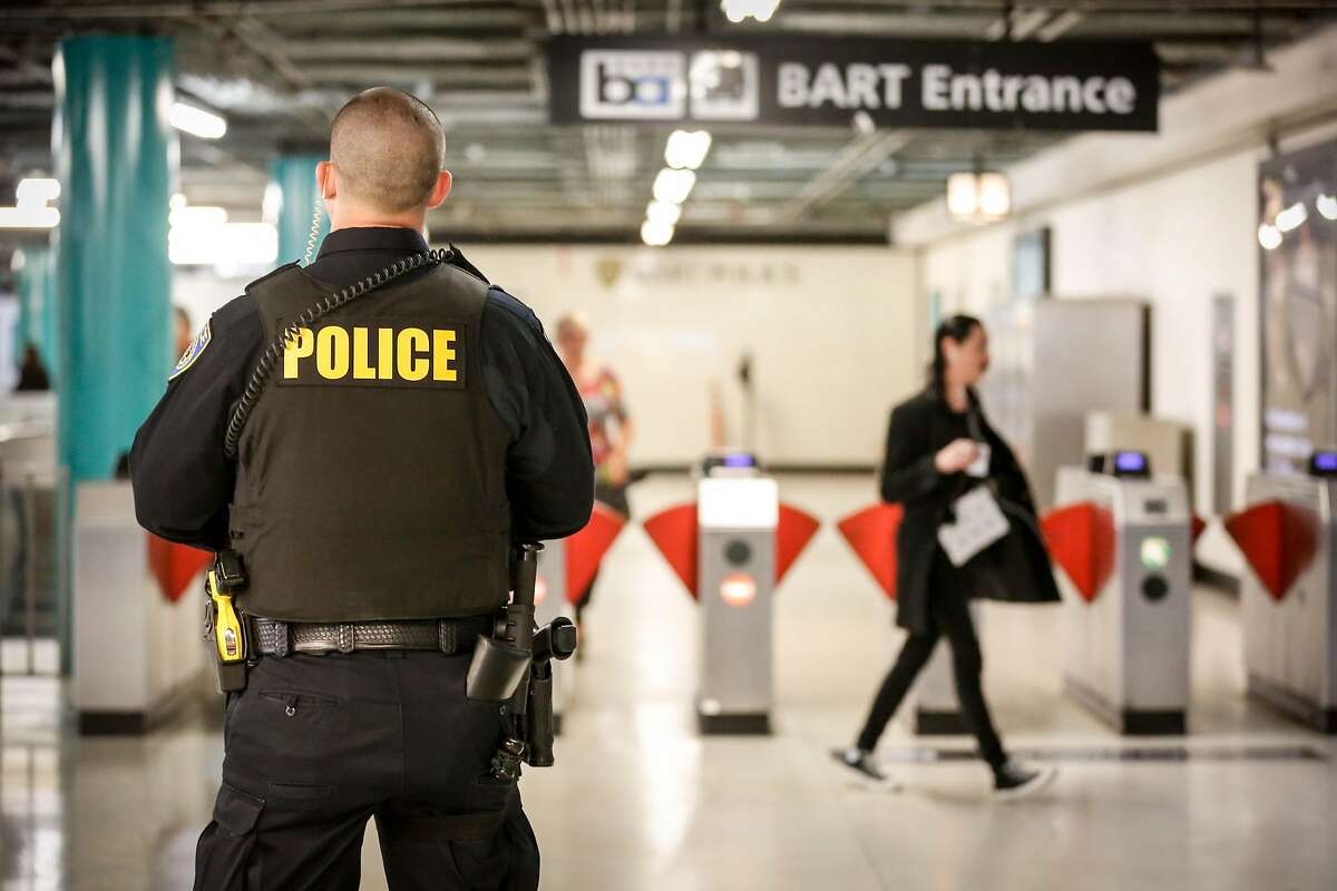 Police officer M. Campbell stands guard at Powell Station BART entrance watching for fare evaders as part of BART's large-scale fare evasion enforcement action on Monday, April 8, 2019 in San Francisco, Calif.