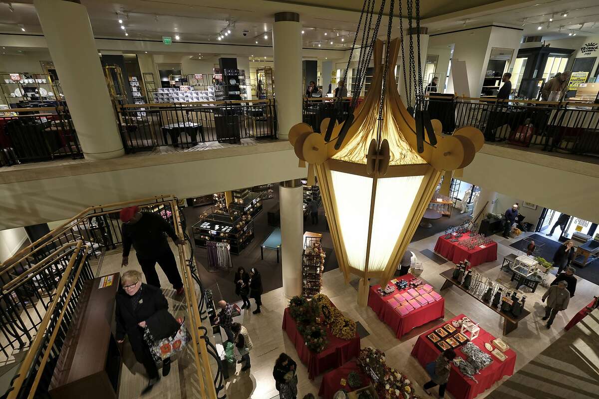People shop during a liquidation sale at the Gump's store Thursday, Dec. 20, 2018, in San Francisco. San Francisco's oldest department store, Gump's, is closing its doors after 157 years in business. Shoppers rummaged through the iconic store's remains Thursday, with all items marked down 70 percent to 90 percent off. Its final day of business is Sunday. (AP Photo/Eric Risberg)