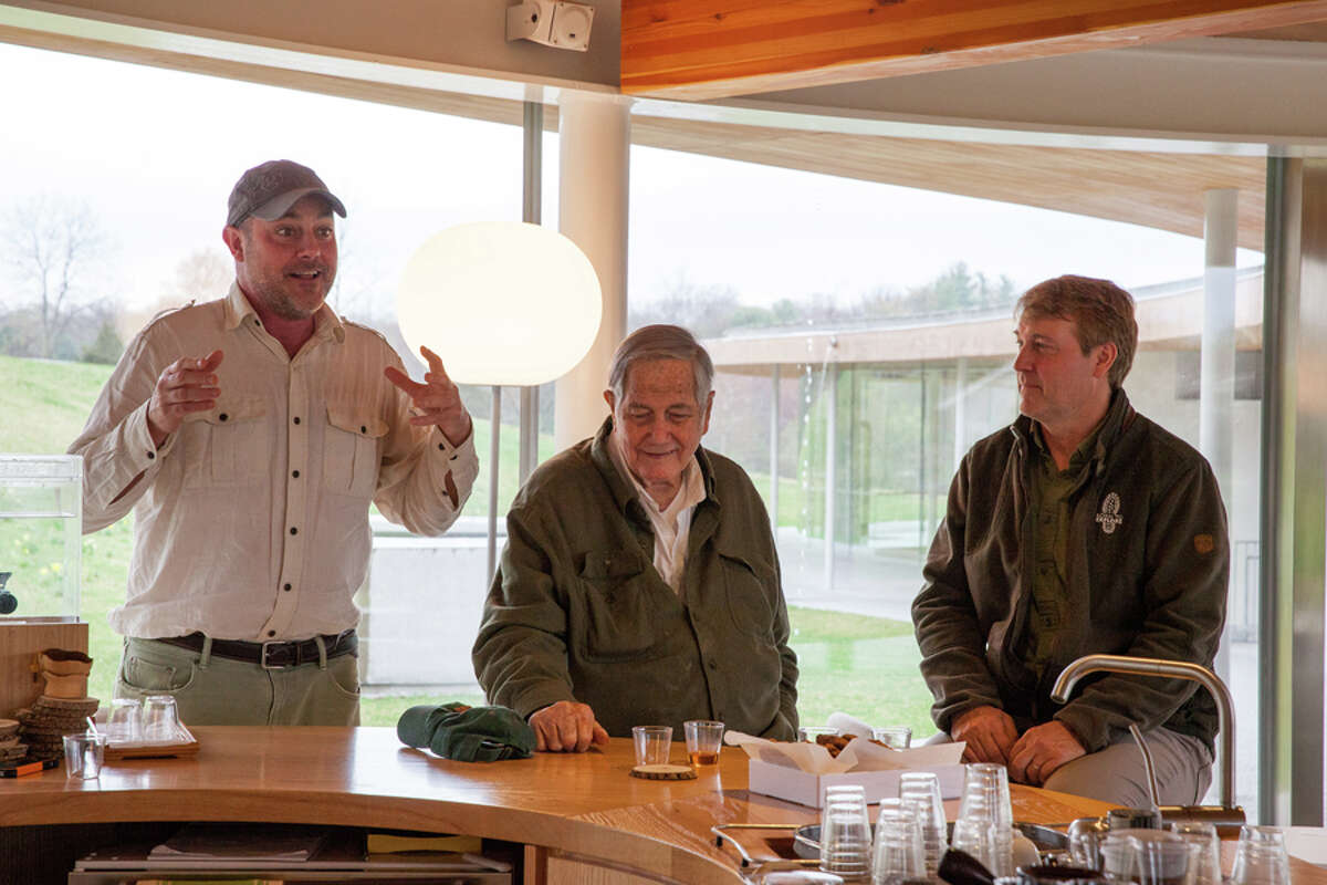Jim Fowler, is flanked by his son Mark (left), Nature Initiative Director at Grace Farms Foundation, and Richard Weise, Emmy Award-winning producer and President of the Explorer’s Club, during an Earth Day program in 2017. Grace Farms Foundation / Contributed photo