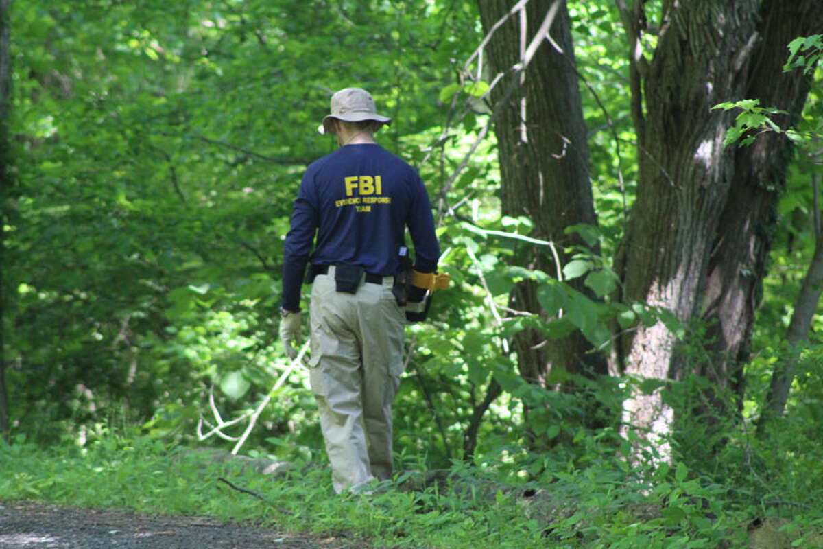 The FBI scoured a secluded area of Waveny Park near Lapham Road for clues in the case of Jennifer Dulos, the mother of five not seen since May 24. A petition on change.org is now calling for cameras throughout the park.