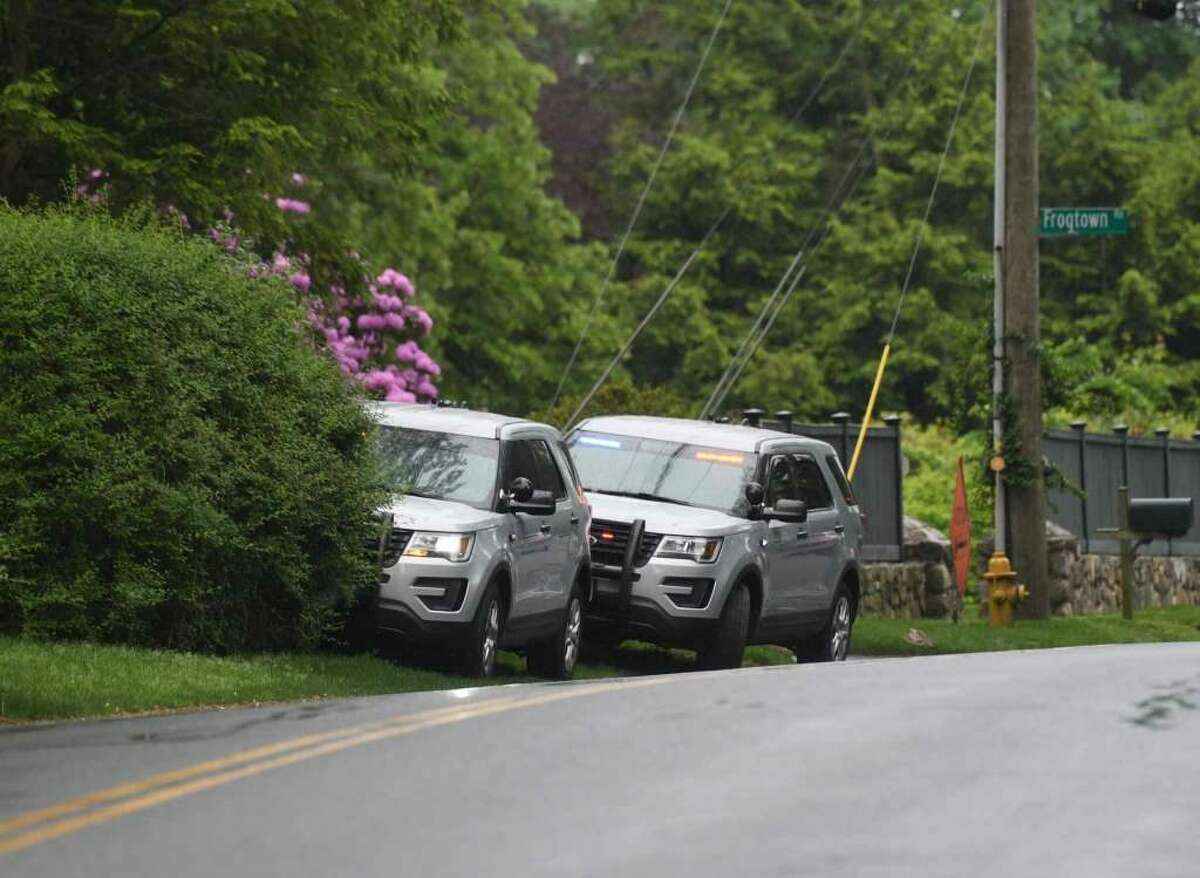 Connecticut State Police park their vehicles near the neighborhood of missing person Jennifer Dulos in New Canaan, Conn. Tuesday, May 28, 2019. Dulos was reported missing Friday evening and police searched the area surrounding her neighborhood with K-9 units on Tuesday. — Tyler Sizemore photo