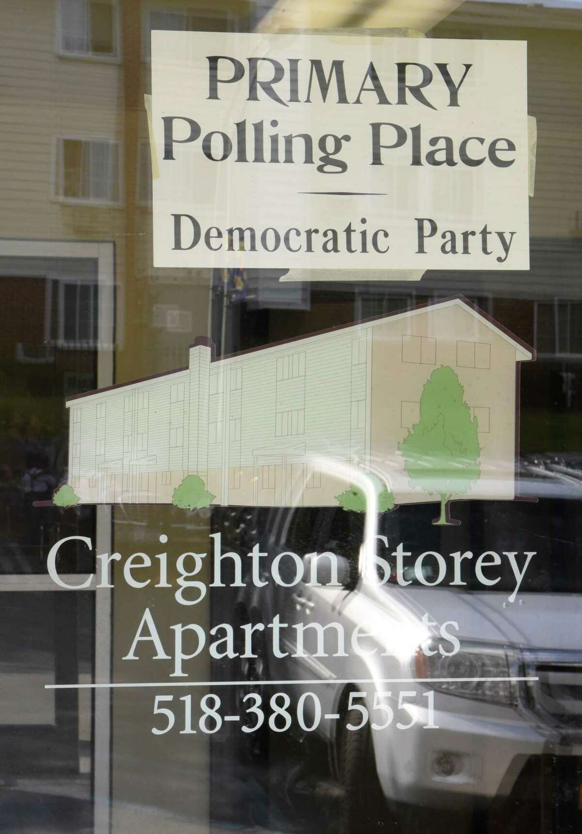 A sign for the primary polling place Democratic Party is seen in a window at the Creighton Storey Homes on Tuesday June 25, 2019 in Albany, N.Y. (Lori Van Buren/Times Union)
