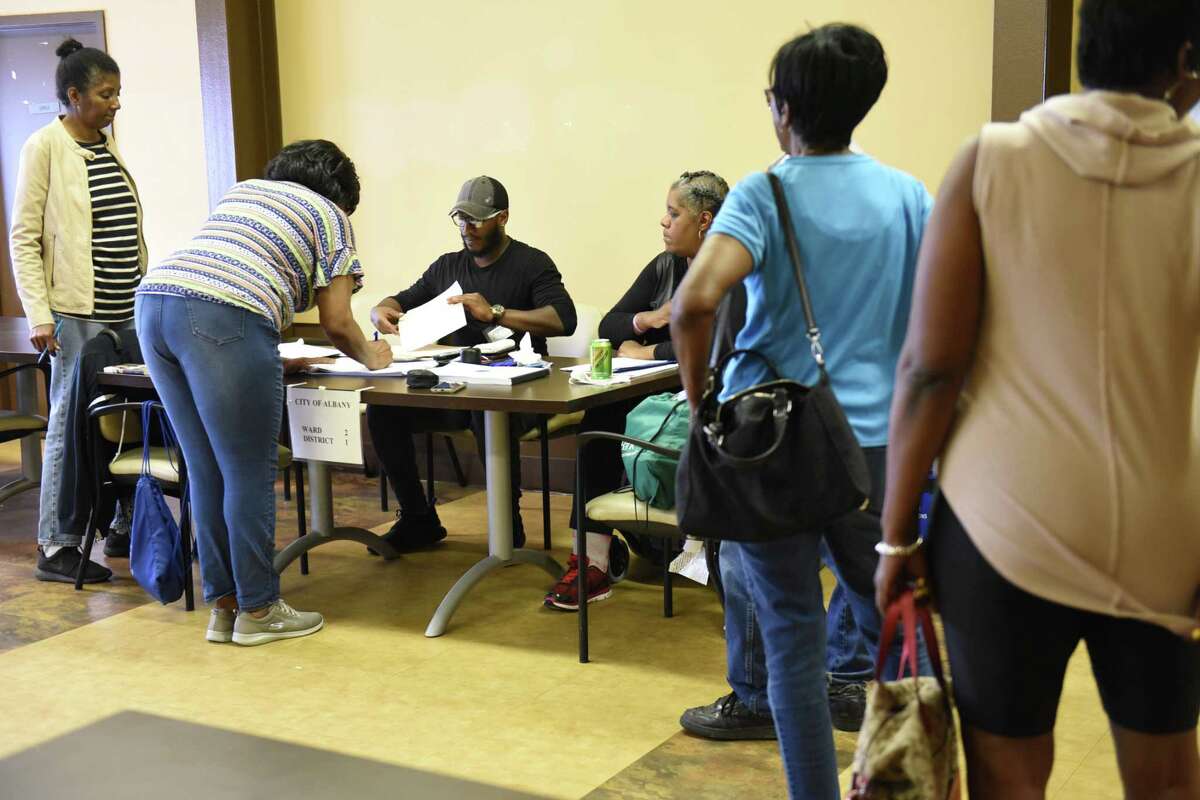 People sign in to vote on primary day at the Creighton Storey Homes on Tuesday June 25, 2019 in Albany, N.Y. (Lori Van Buren/Times Union)