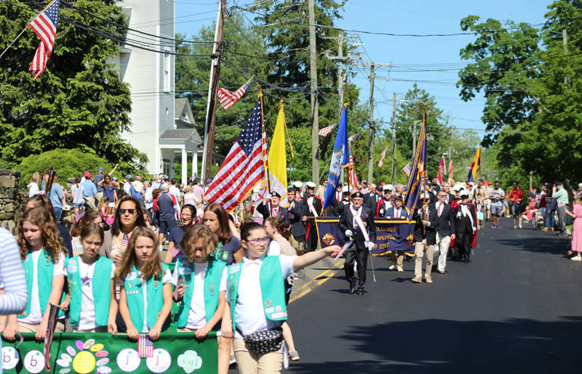 New Canaan residents march down Main Street on Monday, May 27, in observance of Memorial Day. — John Kovach photo