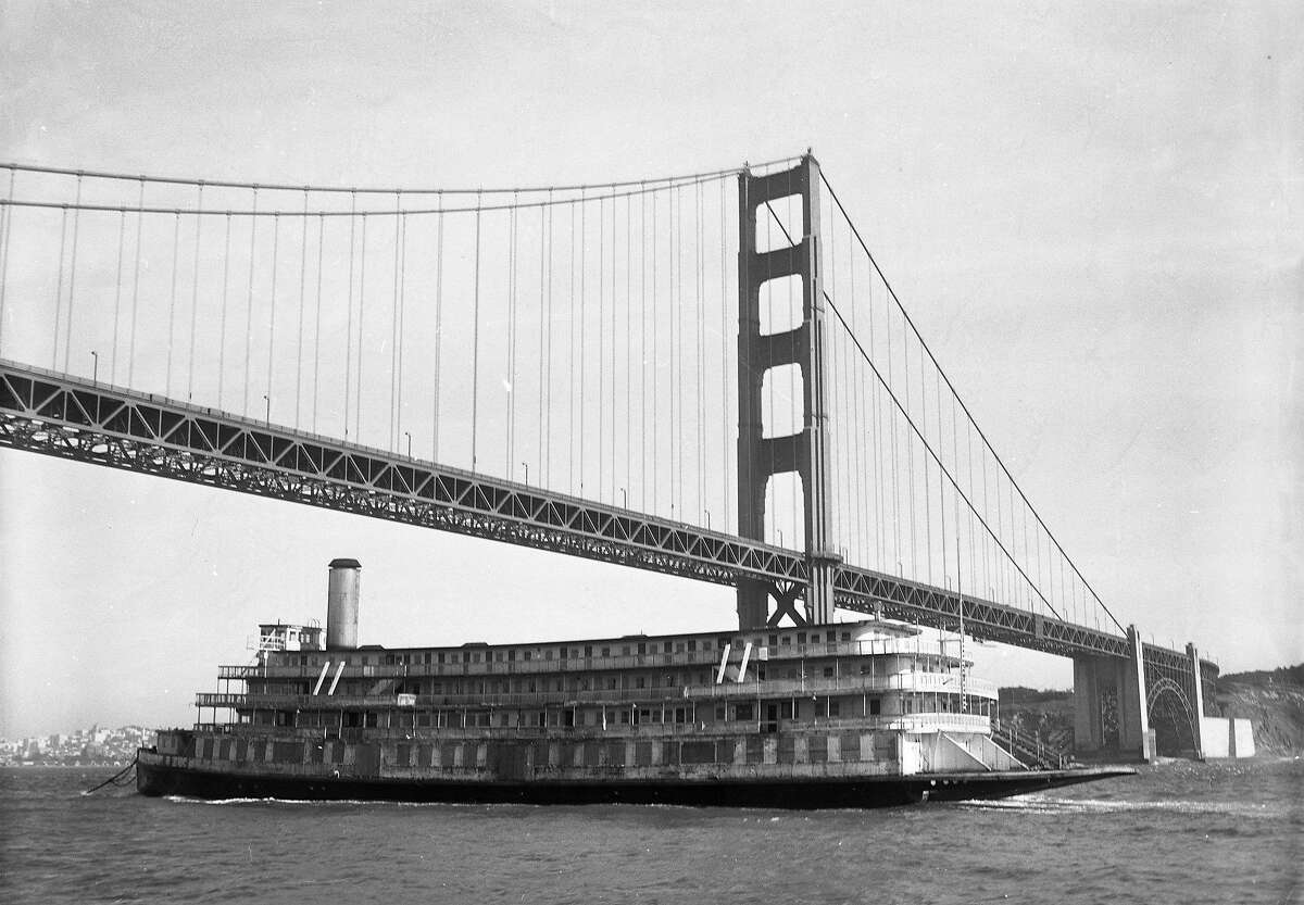 The Delta King passes under the Golden Gate Bridge while returning from British Columbia, 1959