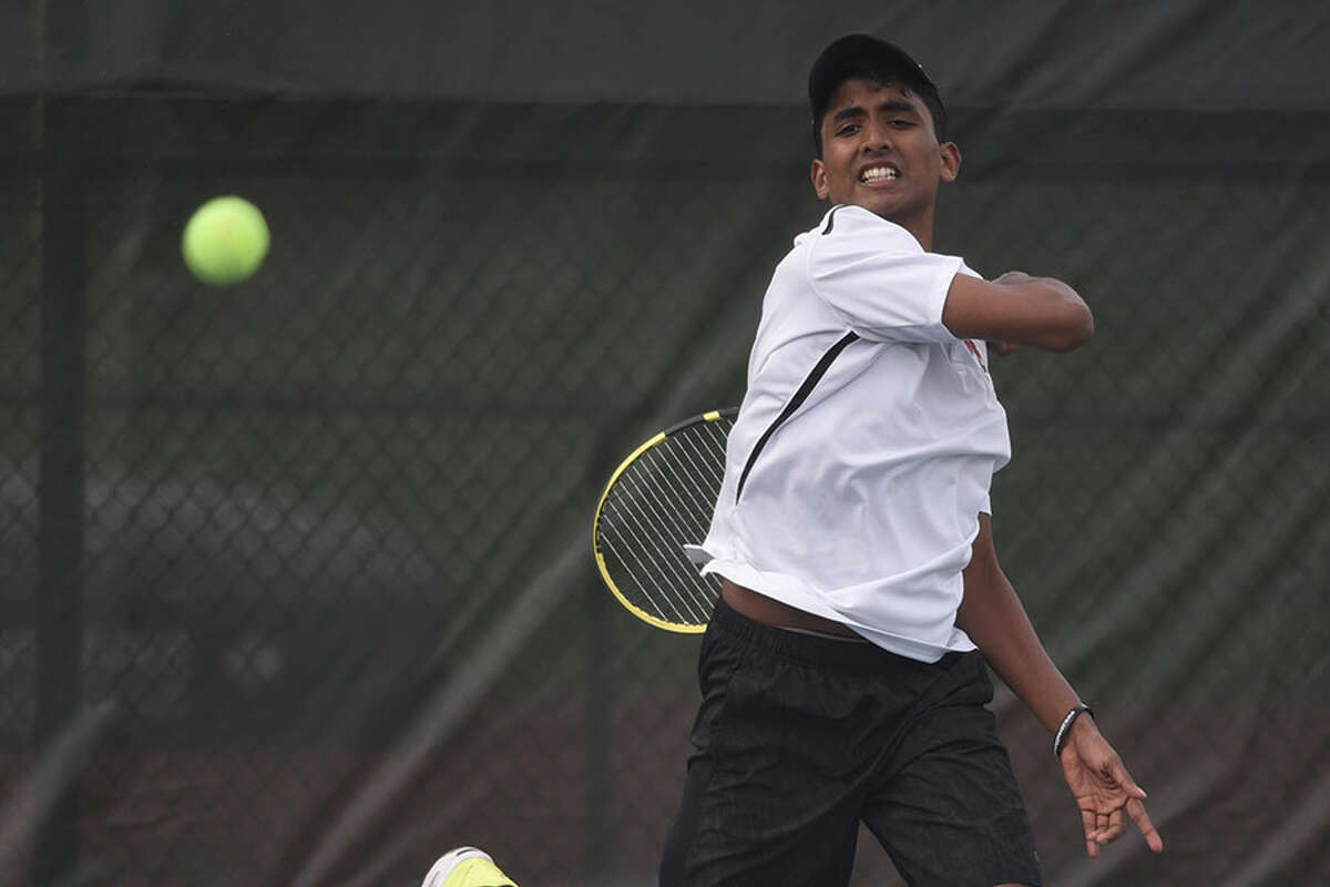 New Canaan’s Sai Akavaramu follows through on a forehand shot during the No. 3 singles match in the Rams’ boys tennis match against Darien at New Canaan High School on Monday, April 29, 2019. — Dave Stewart/Hearst Connecticut Media